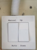 Auto rain sensing or manual awning control switch